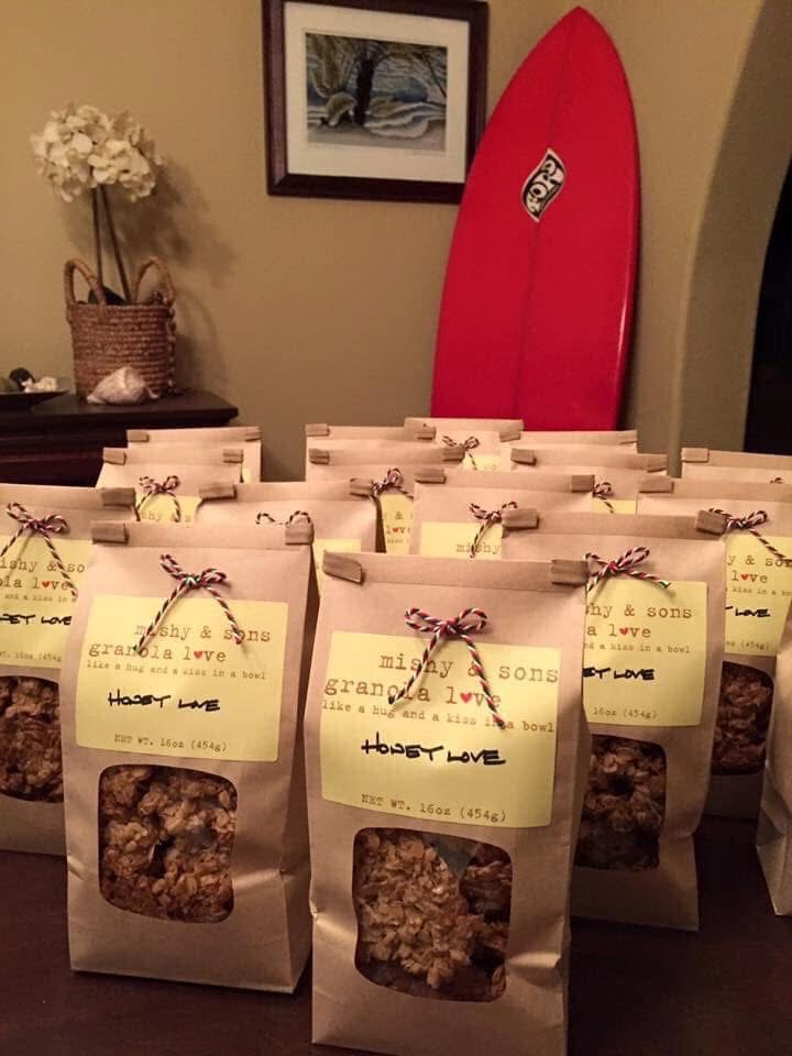 Kraft bags of Honey Love granola tied with baker's twine, ready to go out
