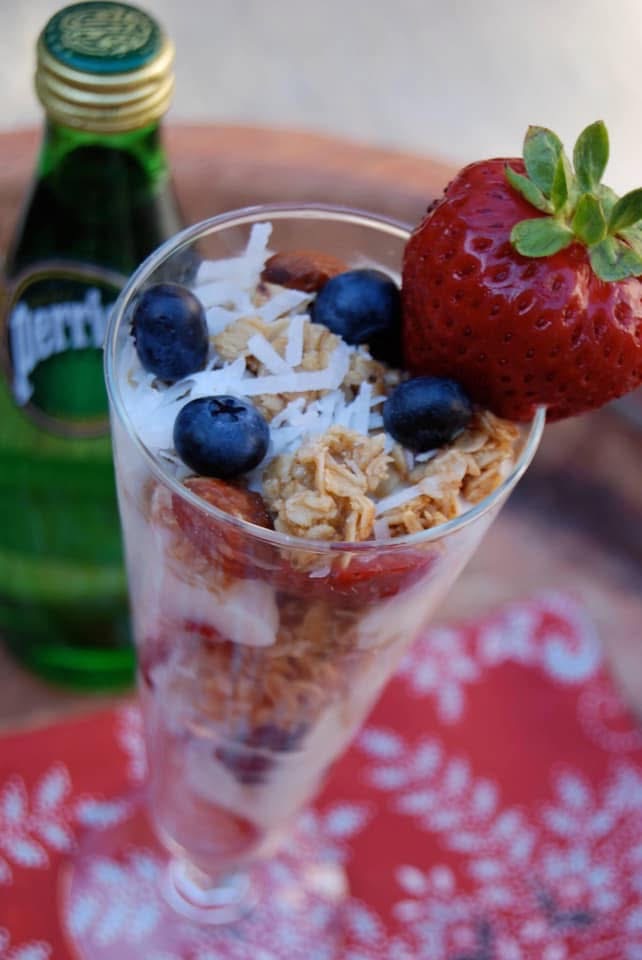 Granola parfait layered with yogurt, berries, almonds and coconut